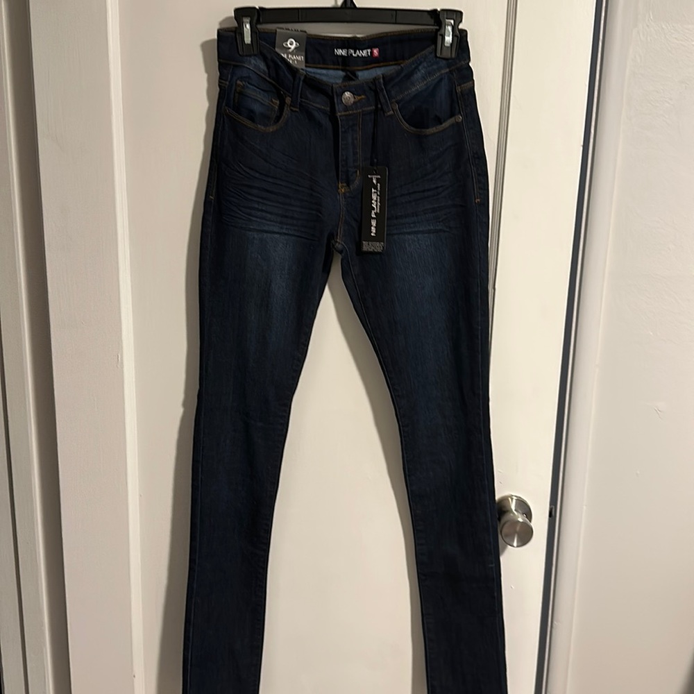 Never worn skinny jeans - dark stone, mid rise.